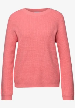 Trui met knoopdetail