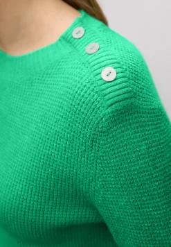 Trui met knoopdetail