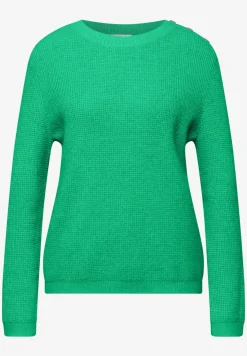 Trui met knoopdetail
