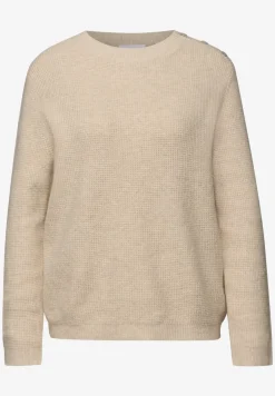 Trui met knoopdetail