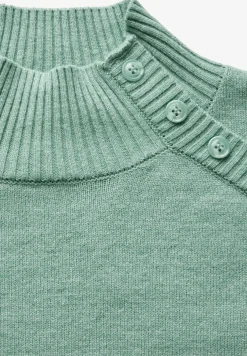 Trui met knoopdetail