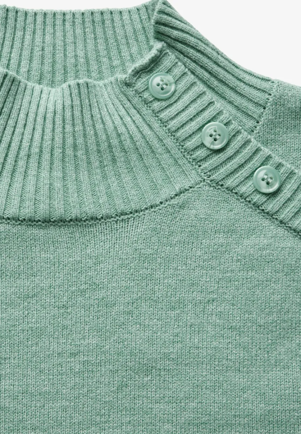 Trui met knoopdetail