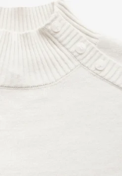 Trui met knoopdetail