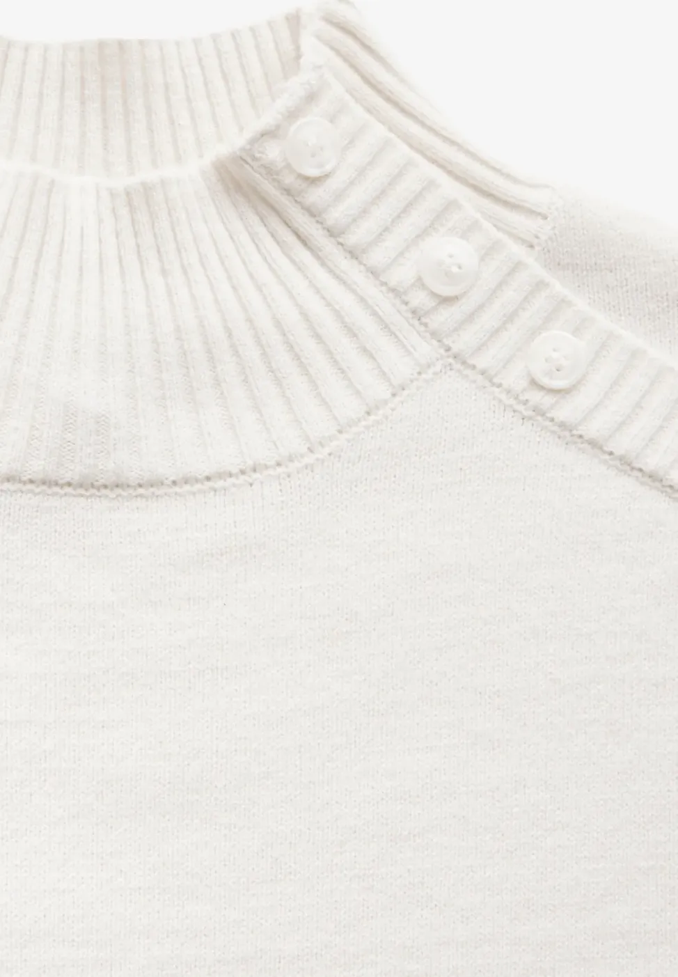 Trui met knoopdetail