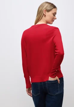 Trui met knoopdetail