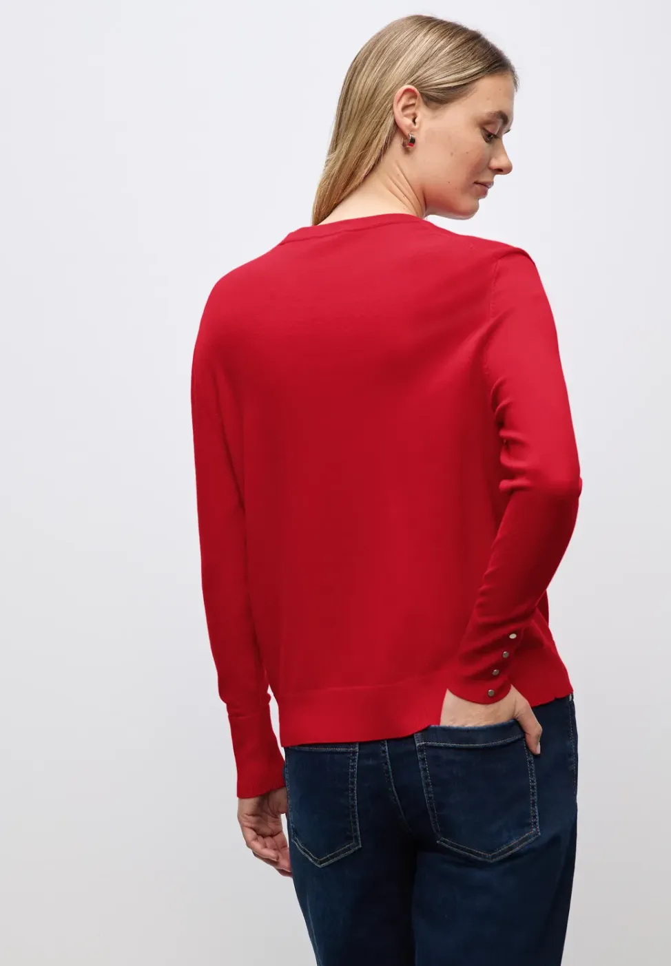 Trui met knoopdetail