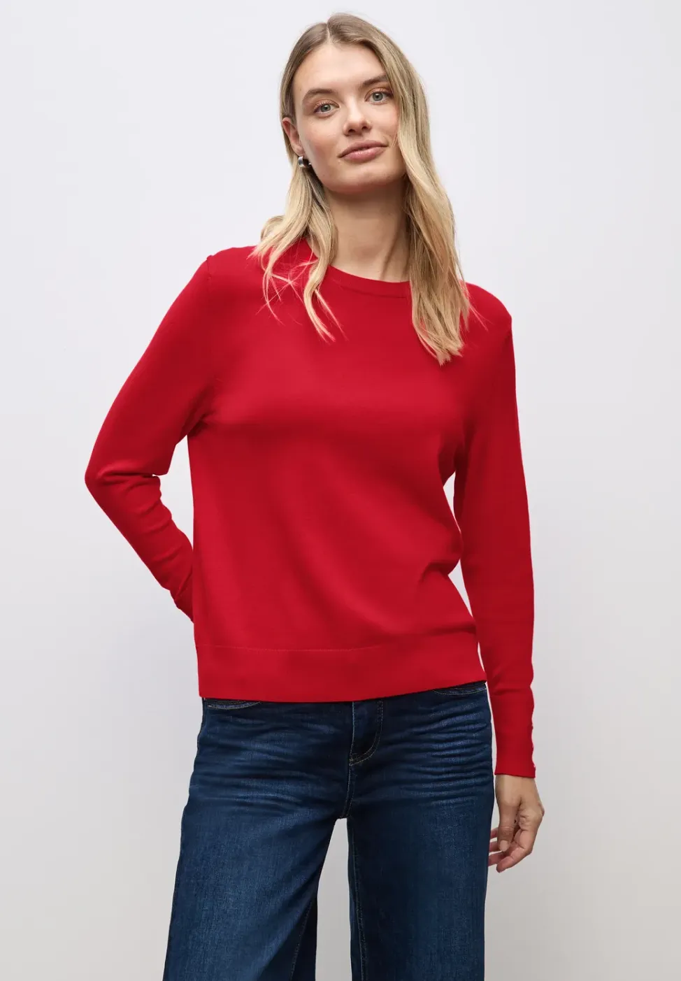 Trui met knoopdetail