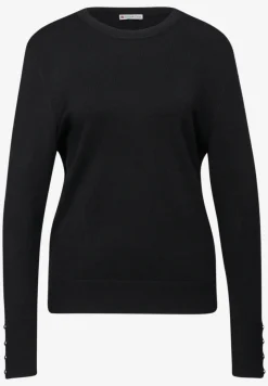 Trui met knoopdetail