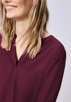 Tuniek met gespleten hals