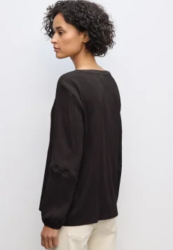 Tuniek met structuur en tape
