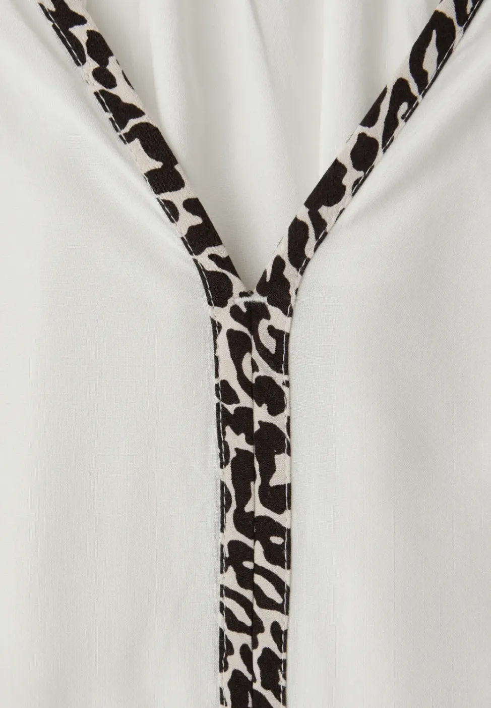 Tuniek met tapedetails